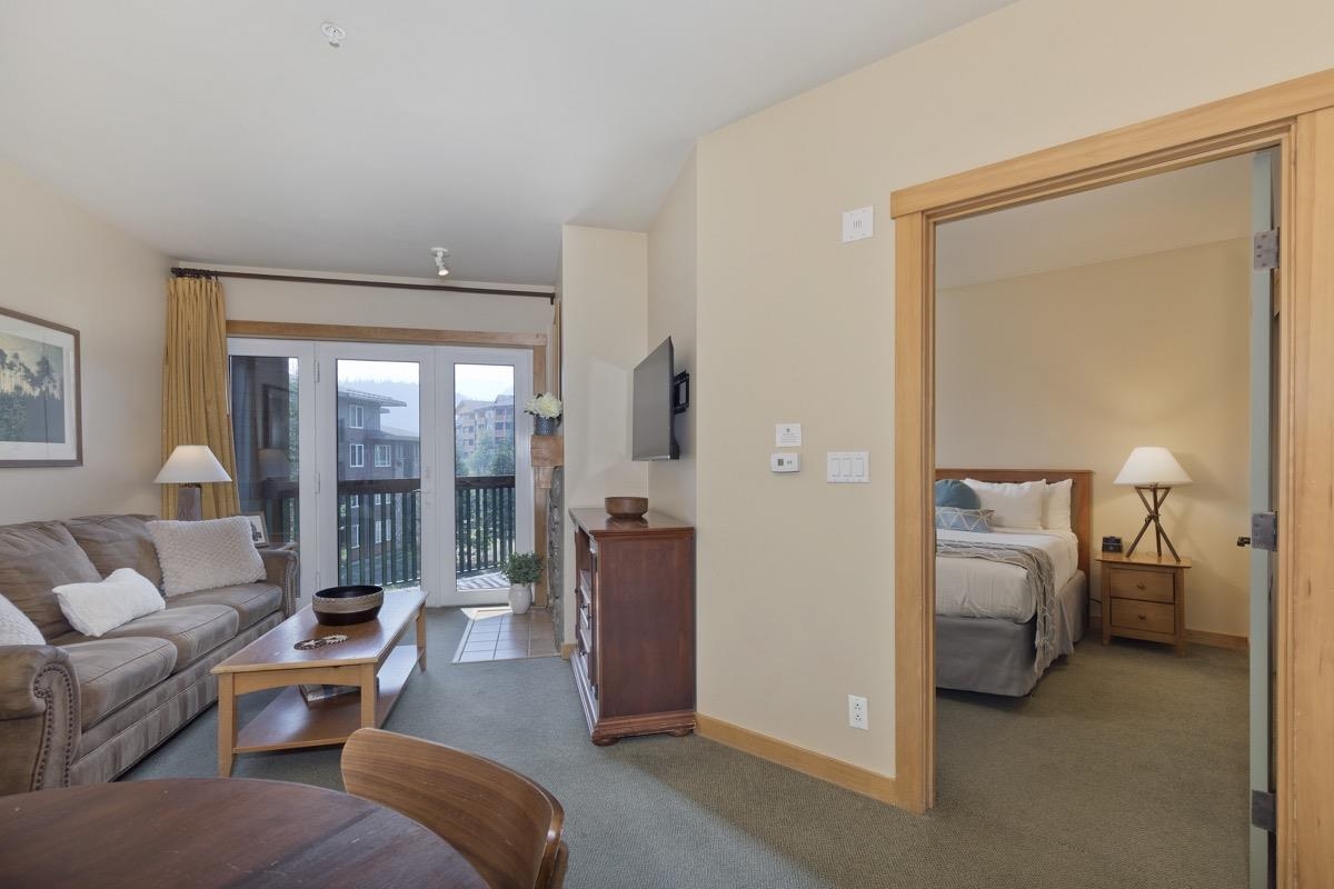 4000 Meridian Boulevard, Unit 436 Mammoth Lakes, CA 93546 - Photo 18 of 46 a living room with furniture and a balcony