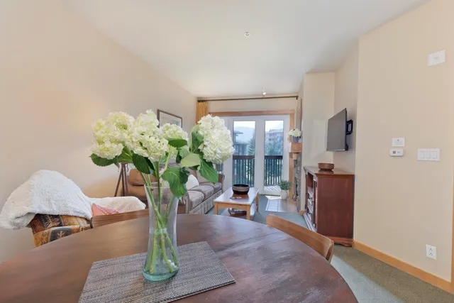 a vase of flowers sitting on a table in a room