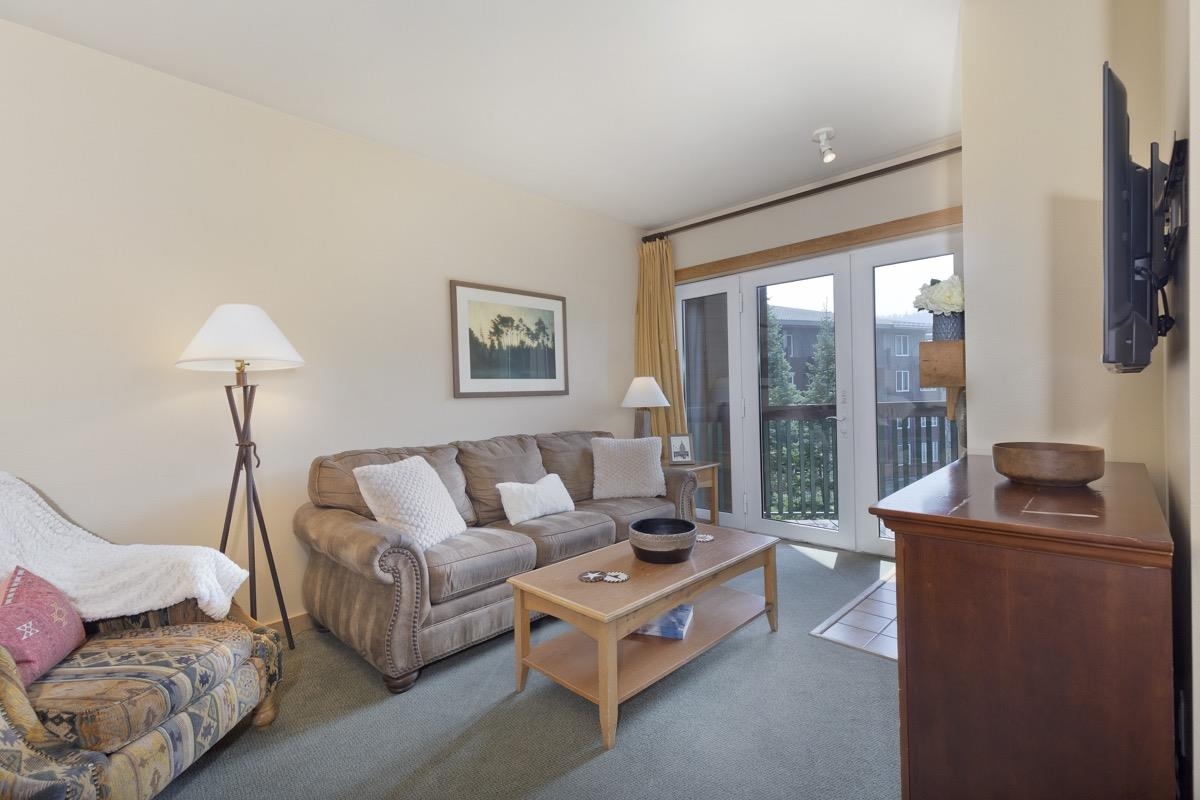4000 Meridian Boulevard, Unit 436 Mammoth Lakes, CA 93546 - Photo 2 of 46 a living room with furniture and a flat screen tv