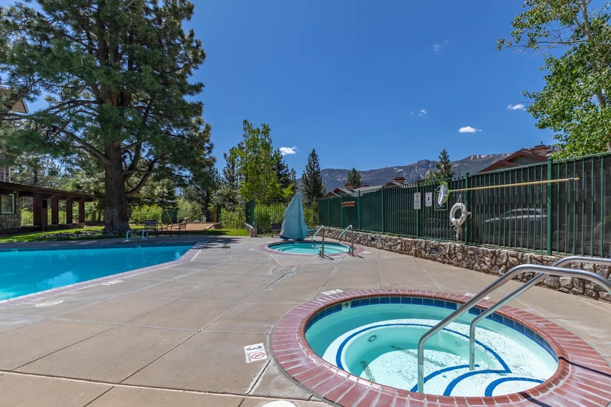 4000 Meridian Boulevard, Unit 436 Mammoth Lakes, CA 93546 - Photo 30 of 46 a backyard of a house with table and chairs