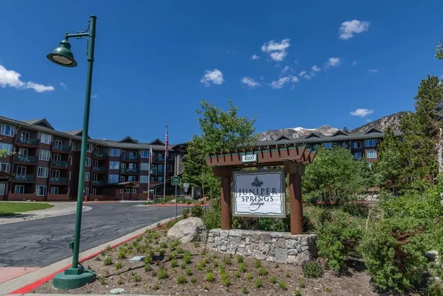 a sign board with a yard in front of it