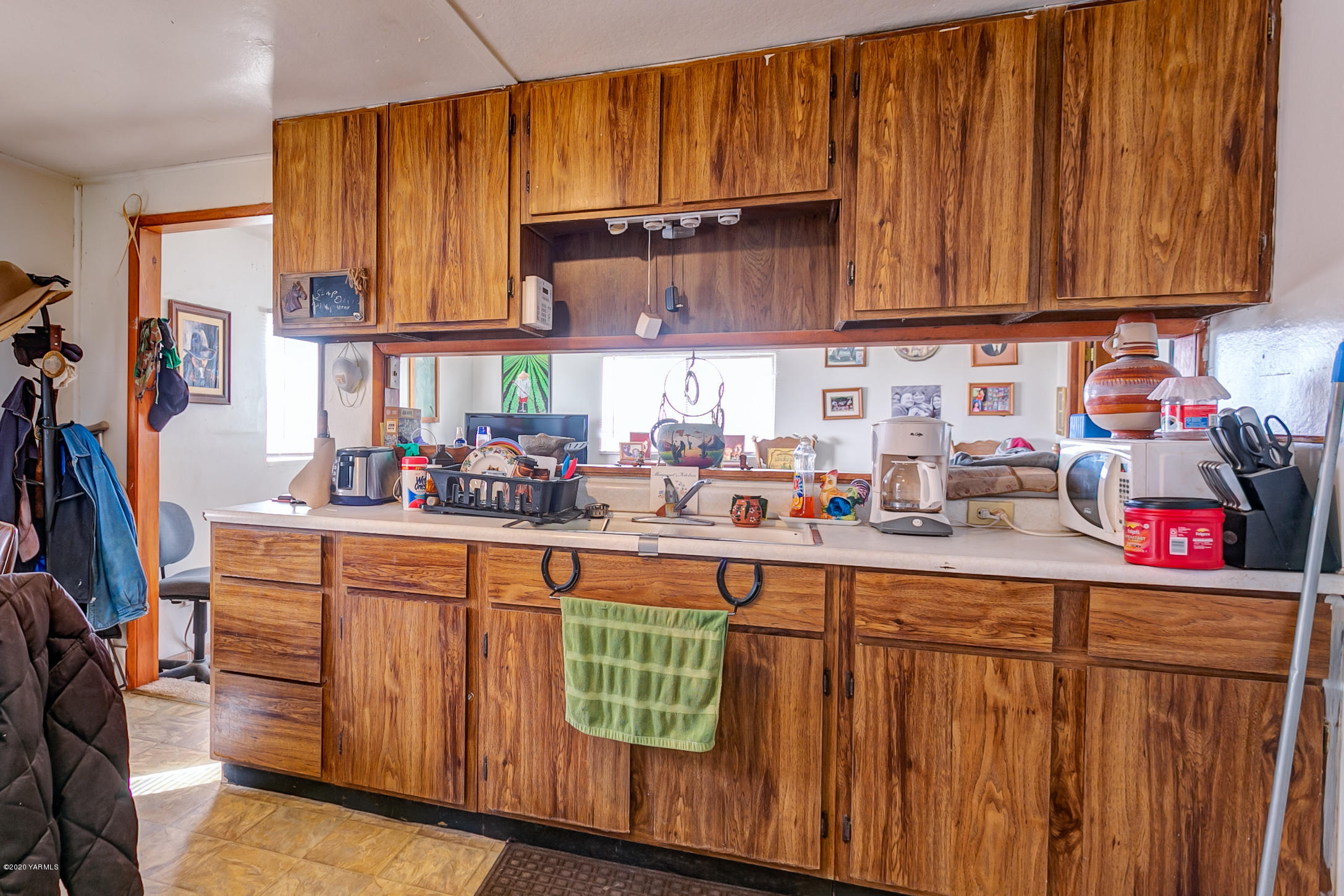 2240 Washout Road Sunnyside, WA 98944 - Photo 27 of 31 a kitchen with stainless steel appliances wooden cabinets sink and a granite counter top