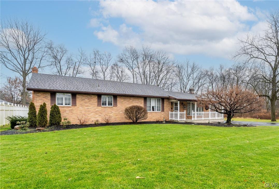 1685 Trexlertown Road Lower Macungie Township, PA 18062 - Photo 1 of 26 a front view of house with yard and green space