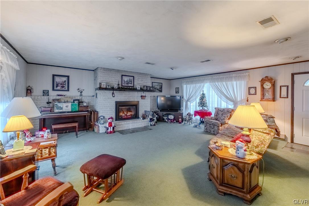 1685 Trexlertown Road Lower Macungie Township, PA 18062 - Photo 15 of 26 a living room with furniture toys and a flat screen tv