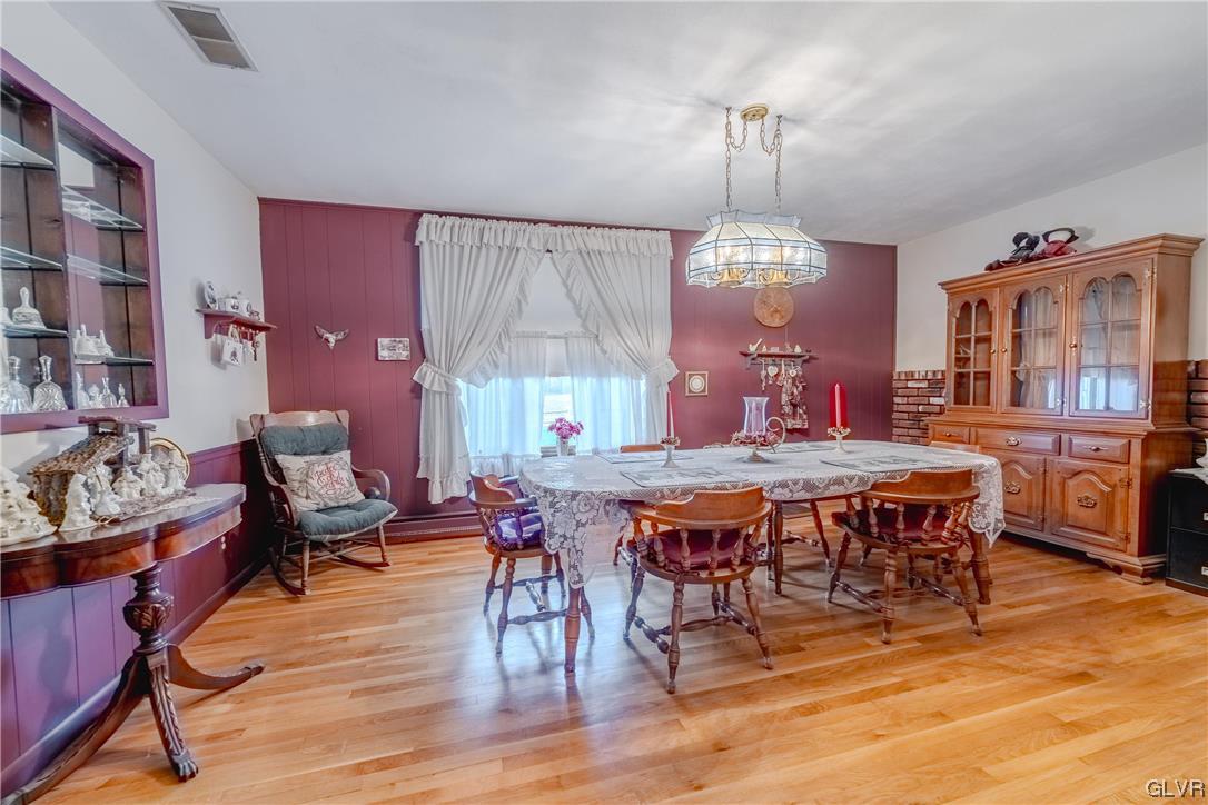 1685 Trexlertown Road Lower Macungie Township, PA 18062 - Photo 20 of 26 a view of a dining room with furniture window and wooden floor