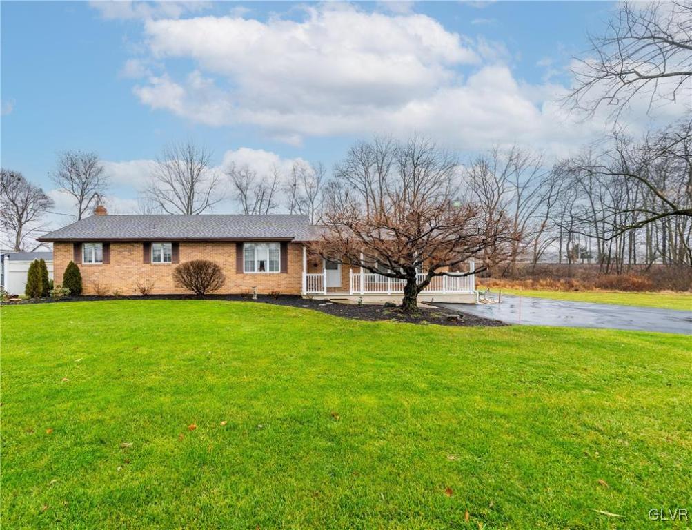 1685 Trexlertown Road Lower Macungie Township, PA 18062 - Photo 2 of 26 a front view of house with yard and entertaining space