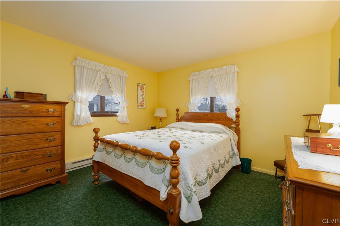 1685 Trexlertown Road Lower Macungie Township, PA 18062 - Photo 22 of 26 a bed sitting in a bedroom next to a window with wooden floor