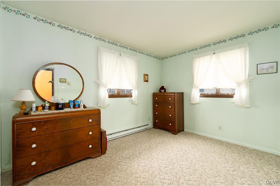 1685 Trexlertown Road Lower Macungie Township, PA 18062 - Photo 23 of 26 a room with a dresser and a mirror