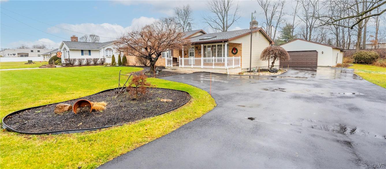 1685 Trexlertown Road Lower Macungie Township, PA 18062 - Photo 3 of 26 a view of a white house with a swimming pool and a yard