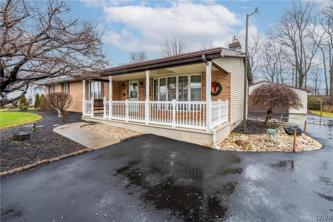 1685 Trexlertown Road Lower Macungie Township, PA 18062 - Photo 4 of 26 a front view of a house with a yard