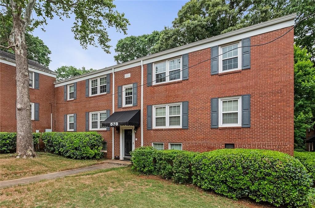 578 Goldsboro Road Northeast, Unit D Atlanta, GA 30307 - Photo 1 of 1 a front view of a house with a yard