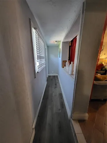 a view of a hallway with windows