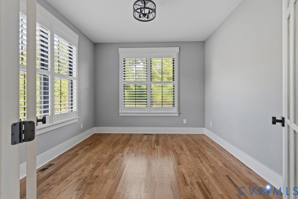 10512 River Road Chesterfield, VA 23838 - Photo 15 of 64 Wood-finish flooring, two windows with plantation