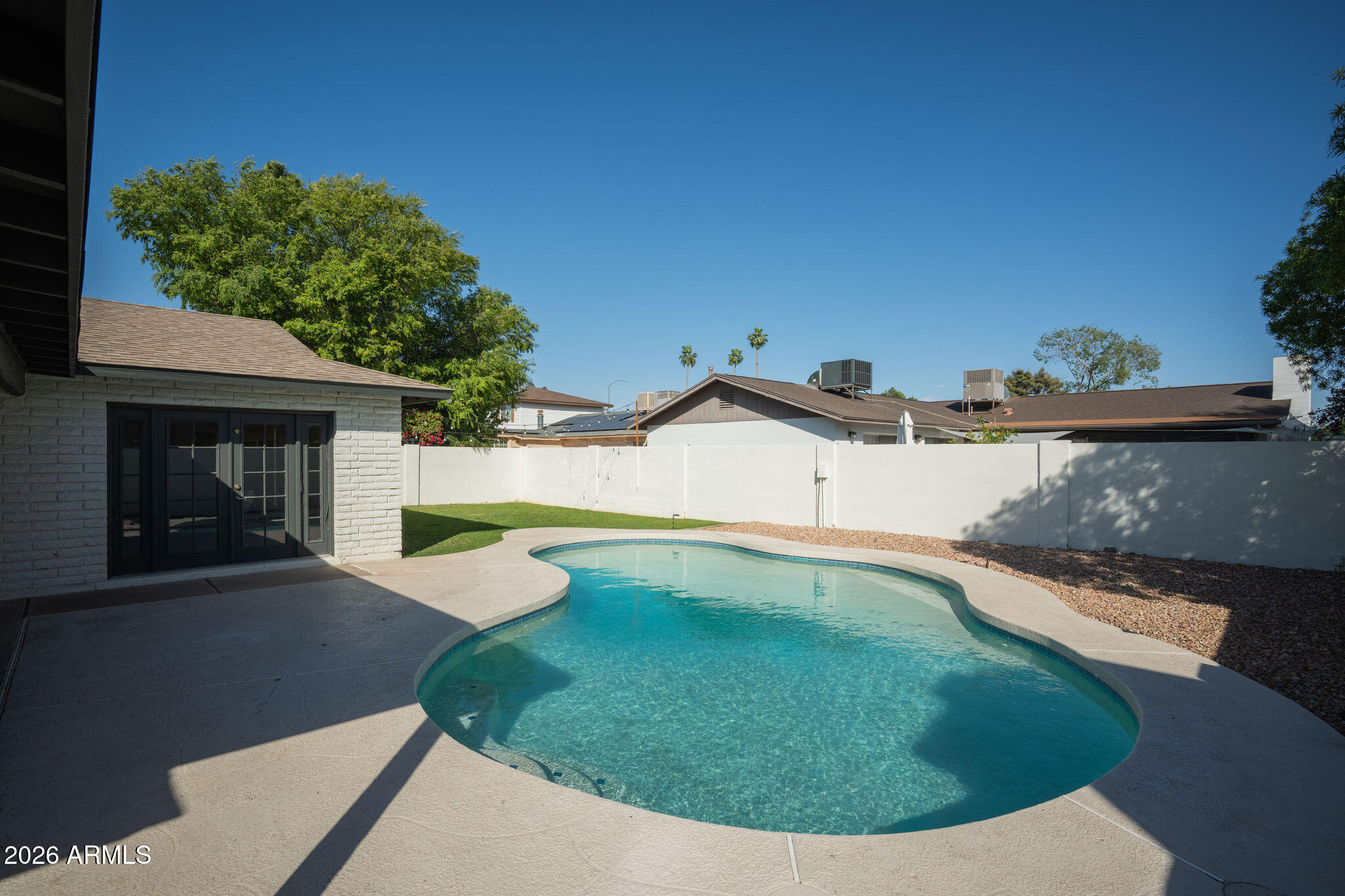 2719 South Playa Mesa, AZ 85202 - Photo 3 of 6 a view of a swimming pool with a yard