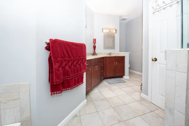 a bathroom with a sink vanity and mirror