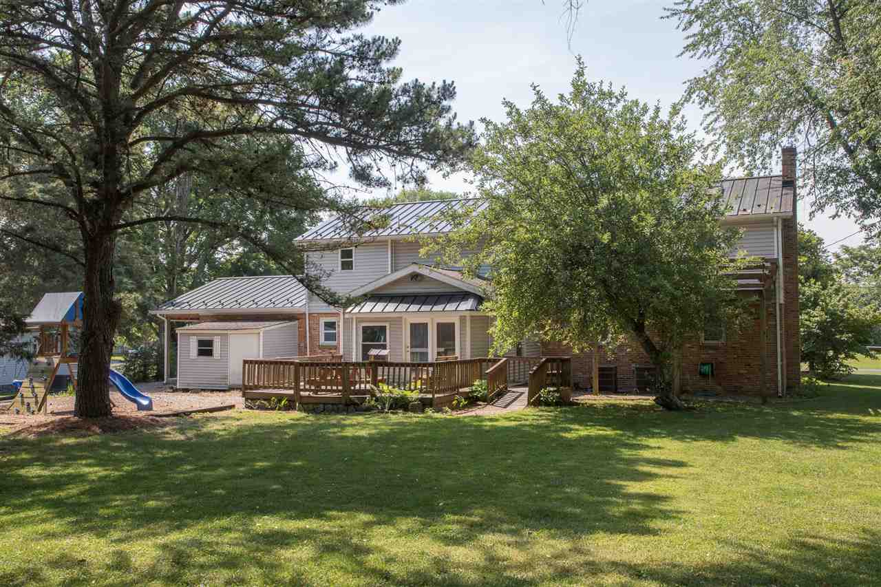 2888 Kerns Road Dayton, VA 22821 - Photo 11 of 49 a front view of a house with a garden and trees