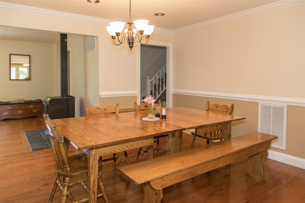2888 Kerns Road Dayton, VA 22821 - Photo 18 of 49 a view of a dining room with furniture and wooden floor