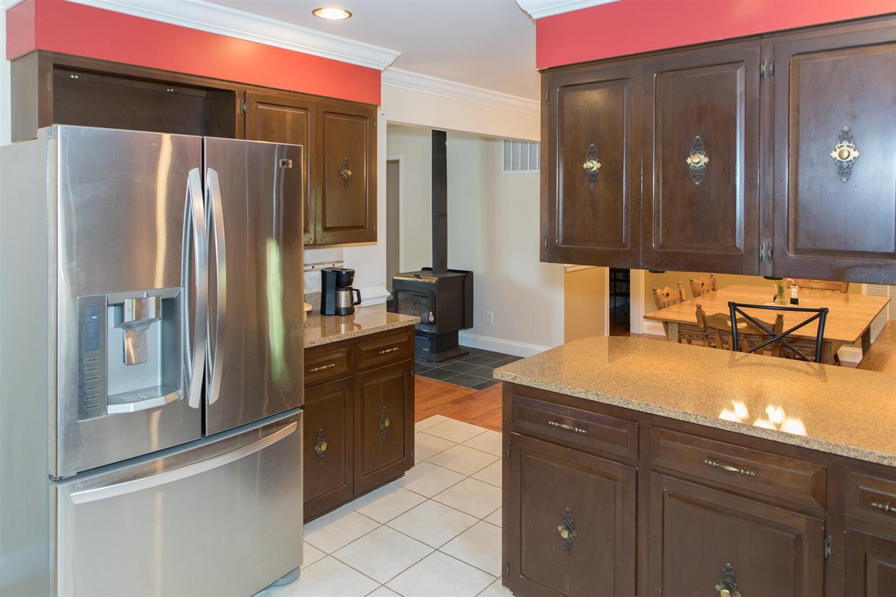 2888 Kerns Road Dayton, VA 22821 - Photo 22 of 49 a kitchen with stainless steel appliances granite countertop a refrigerator and a sink