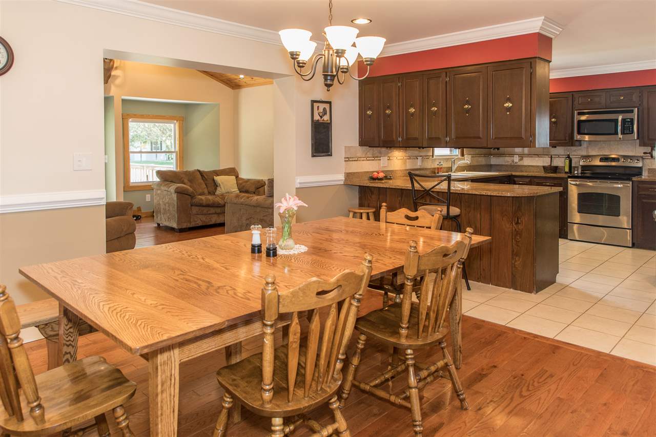 2888 Kerns Road Dayton, VA 22821 - Photo 24 of 49 a view of a dining room with furniture and a chandelier