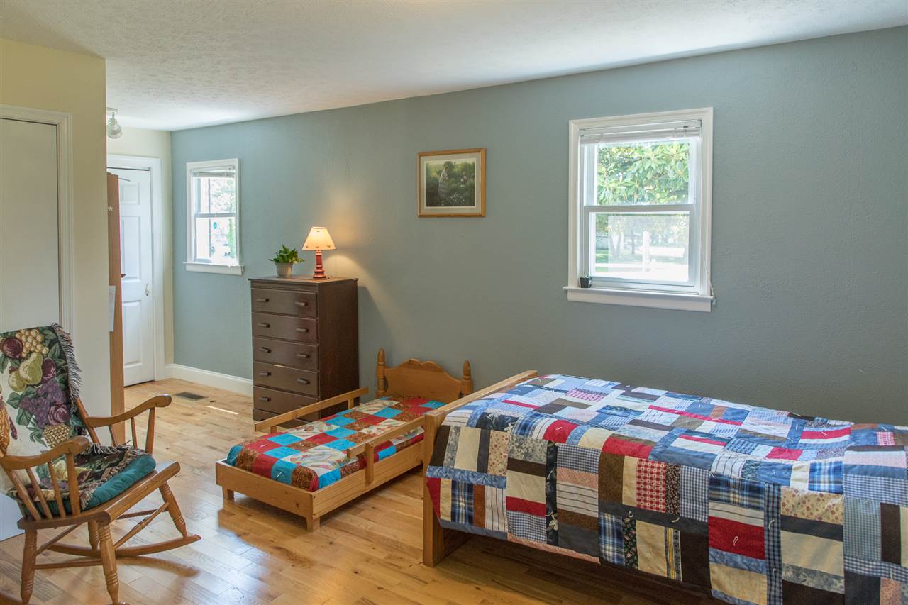 2888 Kerns Road Dayton, VA 22821 - Photo 34 of 49 a bedroom with a bed and wooden floor