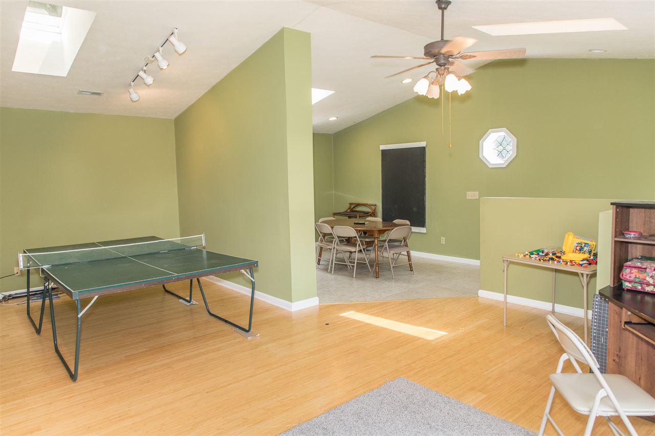 2888 Kerns Road Dayton, VA 22821 - Photo 40 of 49 a room with table chairs and a chandelier