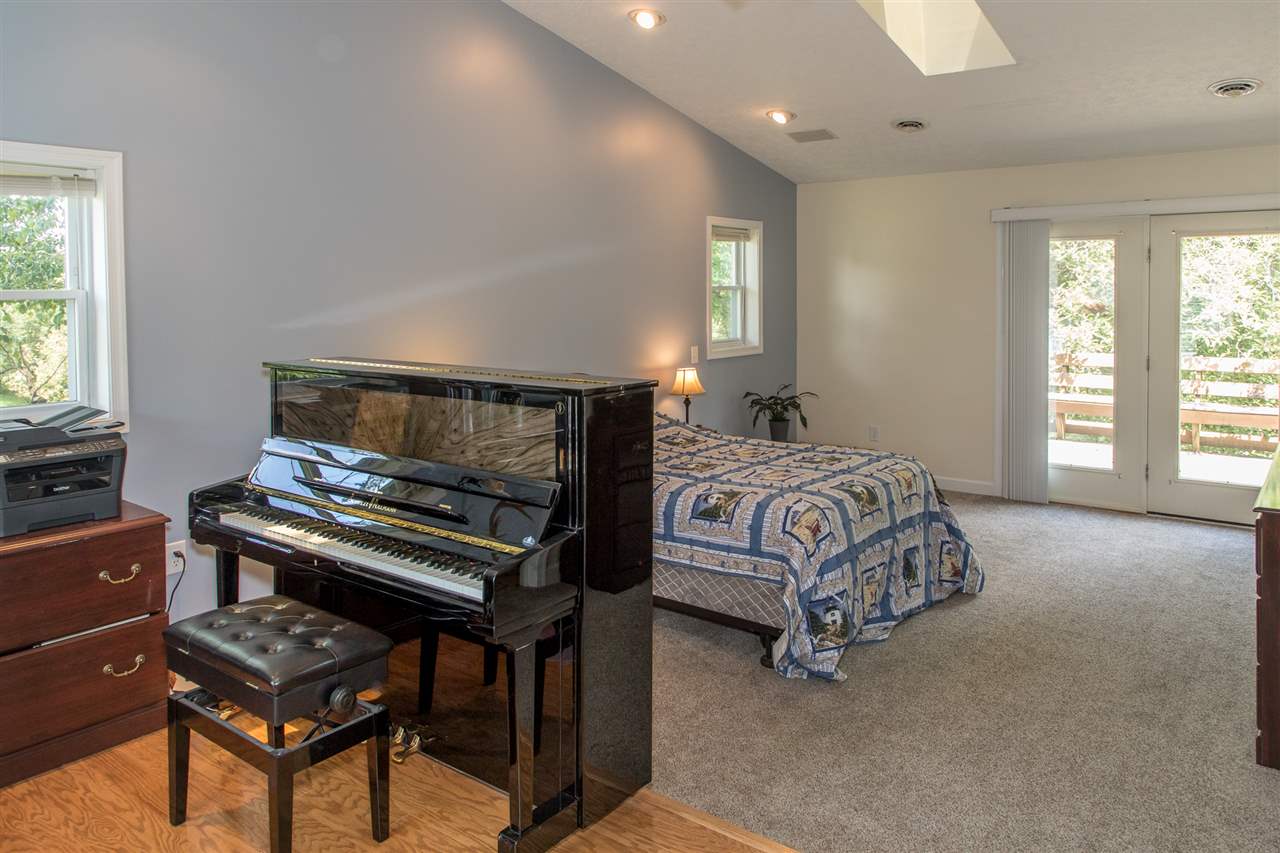 2888 Kerns Road Dayton, VA 22821 - Photo 45 of 49 a bedroom with a bed and a piano
