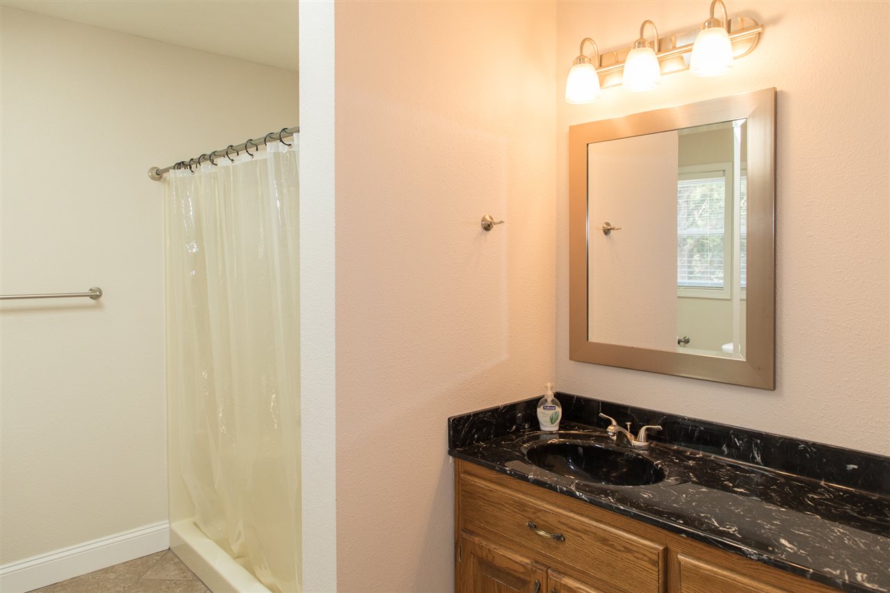 2888 Kerns Road Dayton, VA 22821 - Photo 48 of 49 a bathroom with a granite countertop sink and a mirror