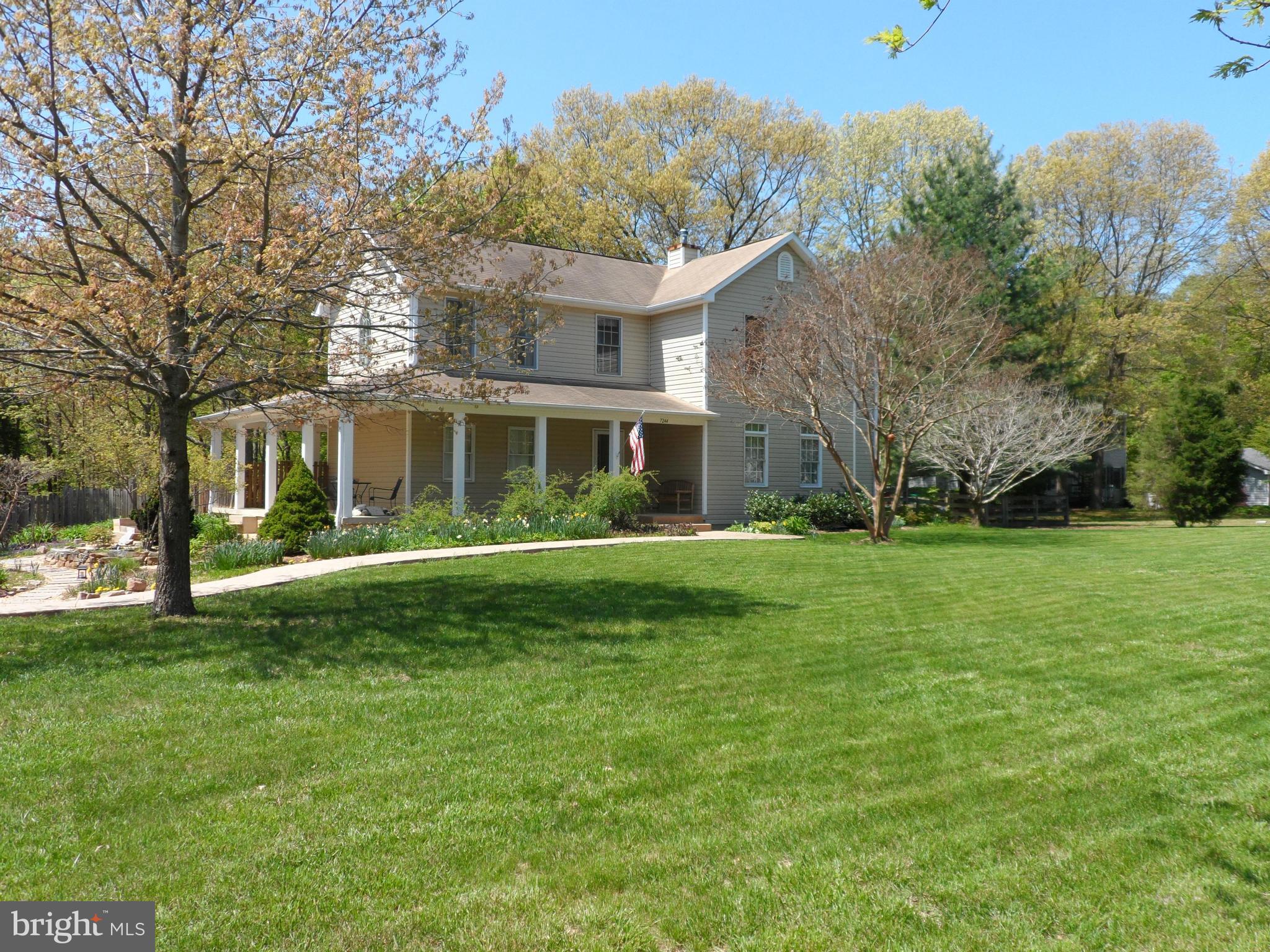 7244 Peppermill Road King George, VA 22485 - Photo 2 of 30 a front view of a house with a garden