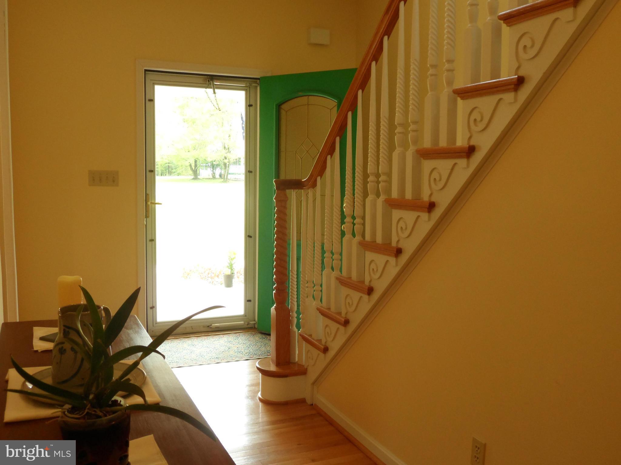 7244 Peppermill Road King George, VA 22485 - Photo 13 of 30 a view of entryway with wooden floor and stairs
