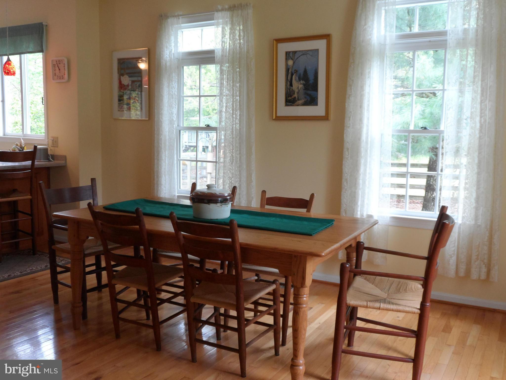 7244 Peppermill Road King George, VA 22485 - Photo 15 of 30 a view of a dining room with furniture and wooden floor