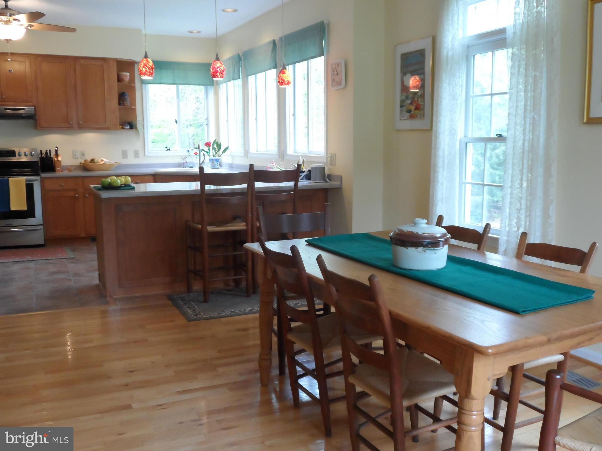 7244 Peppermill Road King George, VA 22485 - Photo 16 of 30 a kitchen with a dining table chairs and window