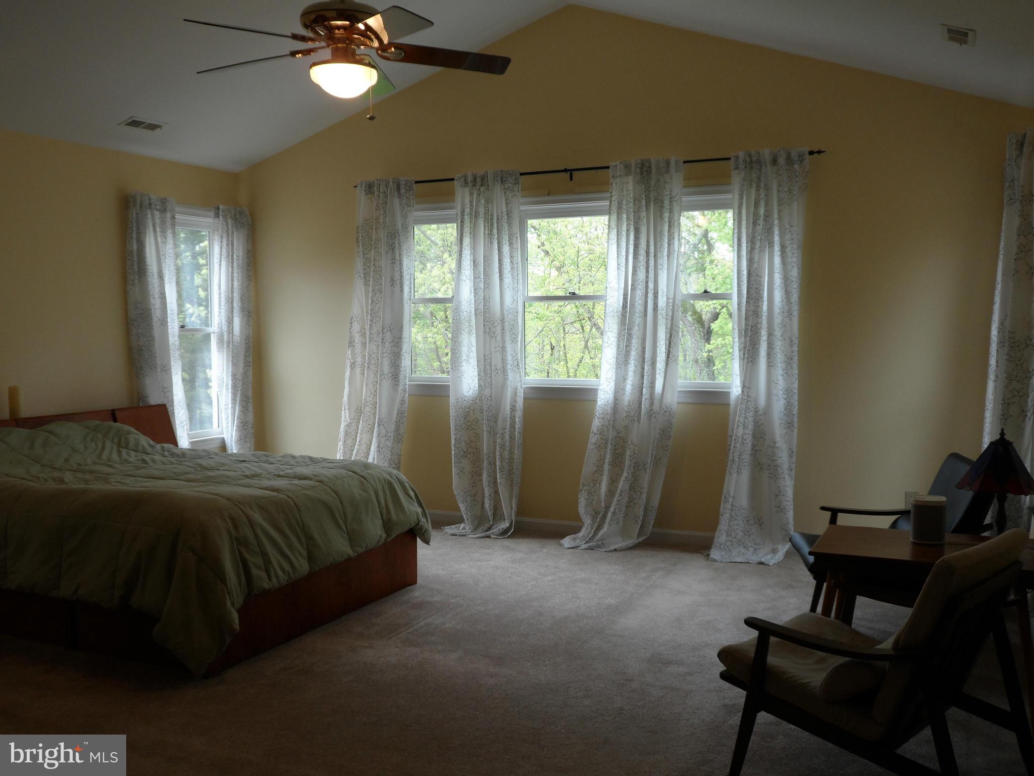 7244 Peppermill Road King George, VA 22485 - Photo 23 of 30 a bedroom with a bed and a window