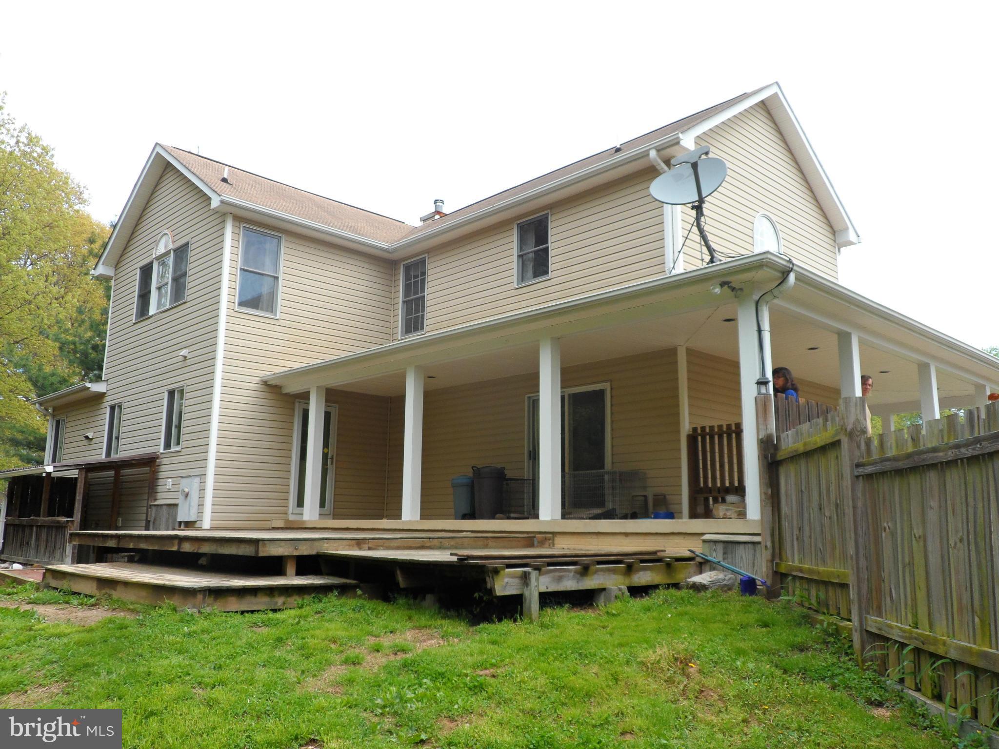 7244 Peppermill Road King George, VA 22485 - Photo 9 of 30 a view of a house with a backyard