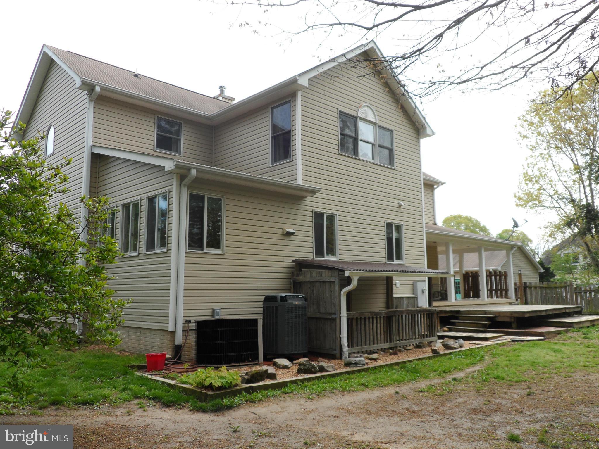 7244 Peppermill Road King George, VA 22485 - Photo 10 of 30 a view of a house with a yard and large tree