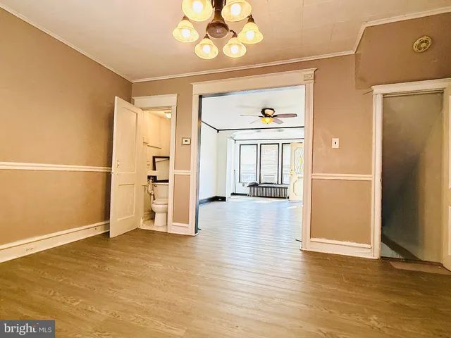 a kitchen with granite countertop sink stove and cabinets