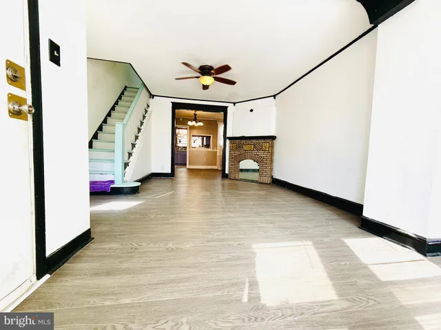 a view of an entryway with wooden floor