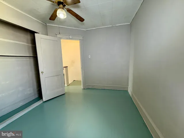 a view of a room with window and cabinet