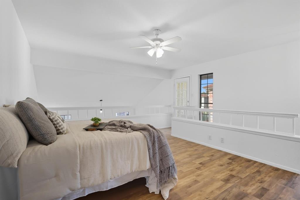 910 Turtle Cove, Unit 148 Irving, TX 75060 - Photo 23 of 33 a bedroom with a bed and a window