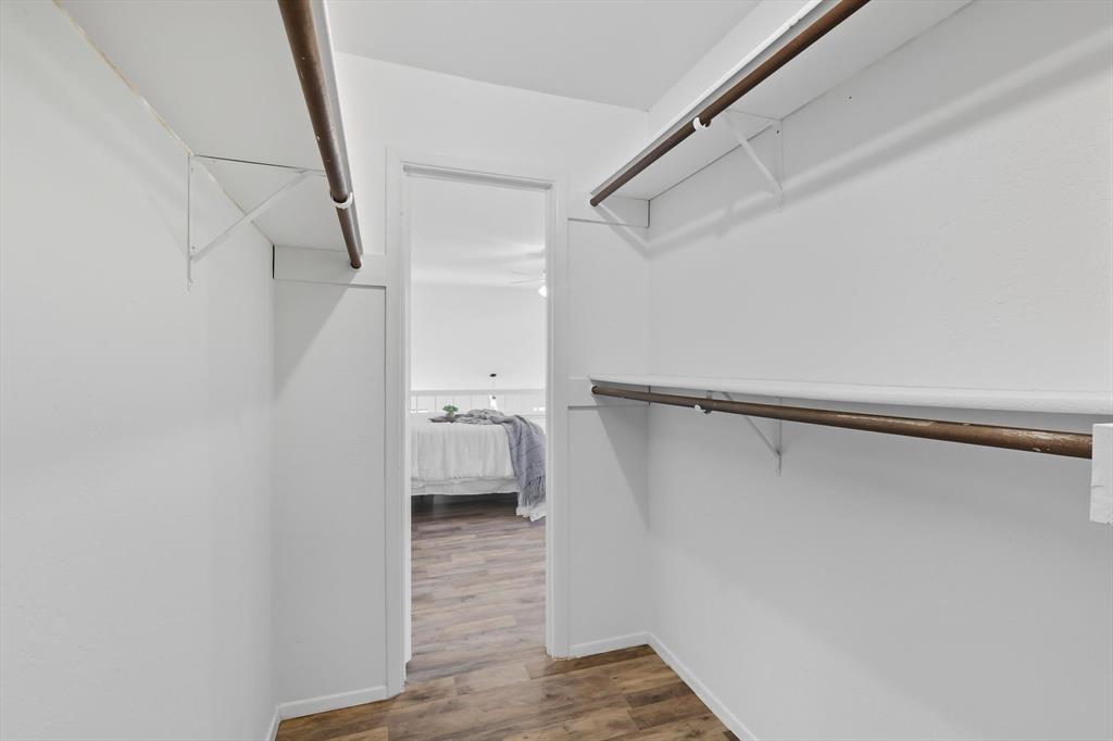 910 Turtle Cove, Unit 148 Irving, TX 75060 - Photo 26 of 33 a view of a room with wooden floor and staircase