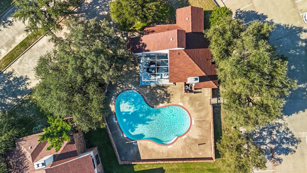 910 Turtle Cove, Unit 148 Irving, TX 75060 - Photo 32 of 33 an aerial view of a house with swimming pool and outdoor seating