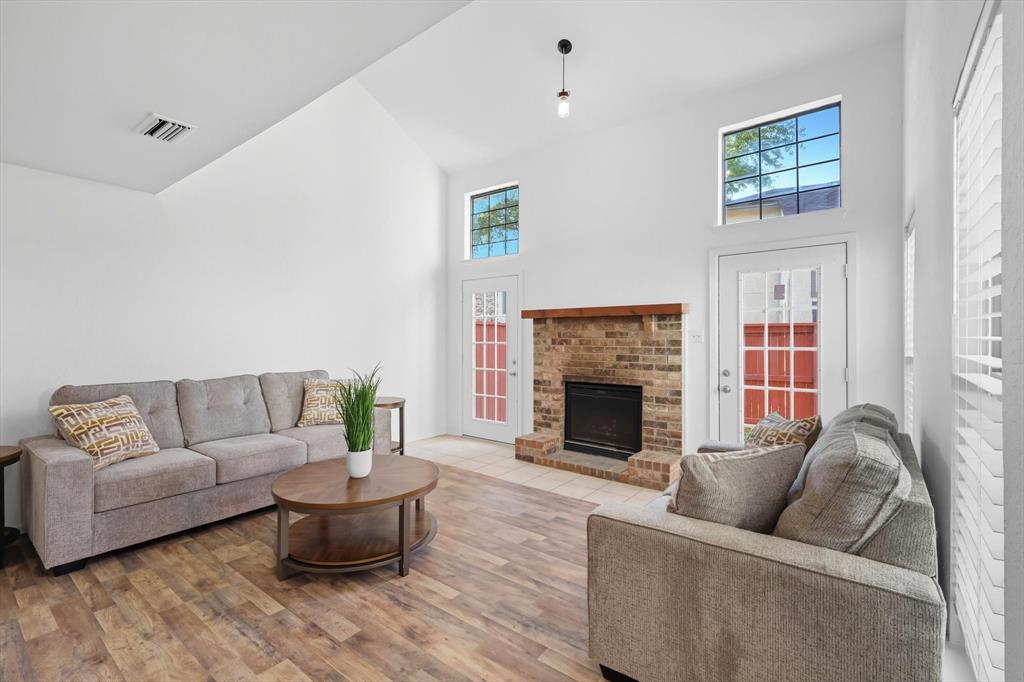 910 Turtle Cove, Unit 148 Irving, TX 75060 - Photo 4 of 33 a living room with furniture and a fireplace