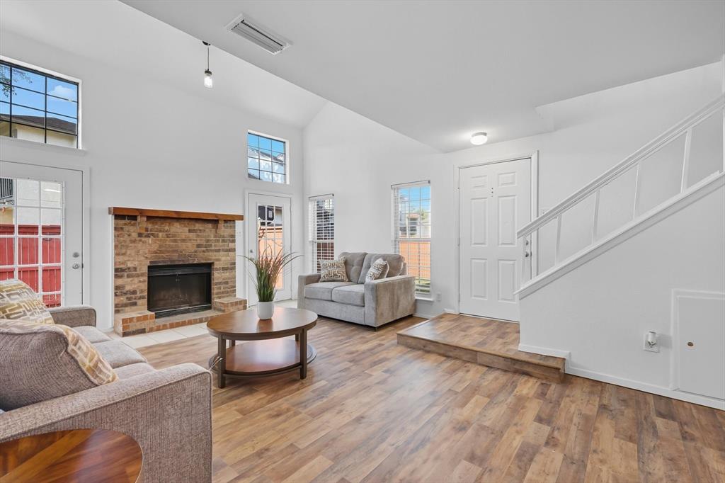 910 Turtle Cove, Unit 148 Irving, TX 75060 - Photo 6 of 33 a living room with furniture and a fireplace