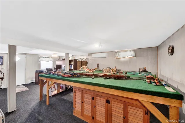 a living room with furniture and garden view