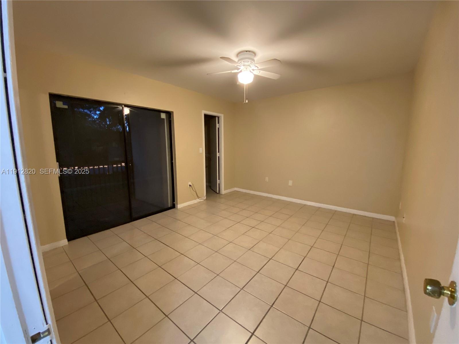 10370 Southwest 220th Street, Unit 221 Cutler Bay, FL 33190 - Photo 7 of 8 a view of an empty room