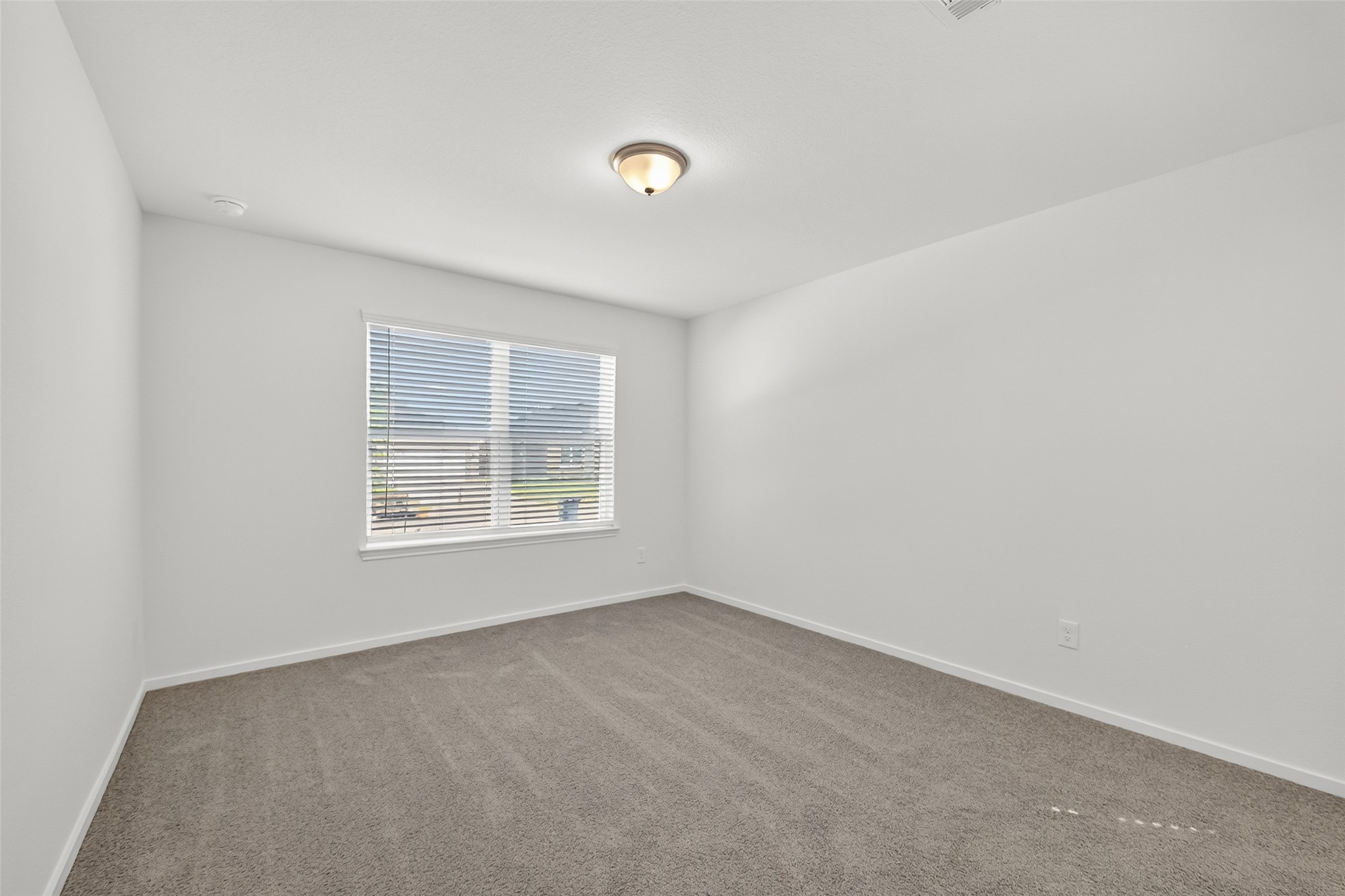 2111 Spring Hollow Drive Baytown, TX 77521 - Photo 16 of 42 a view of an empty room with a window