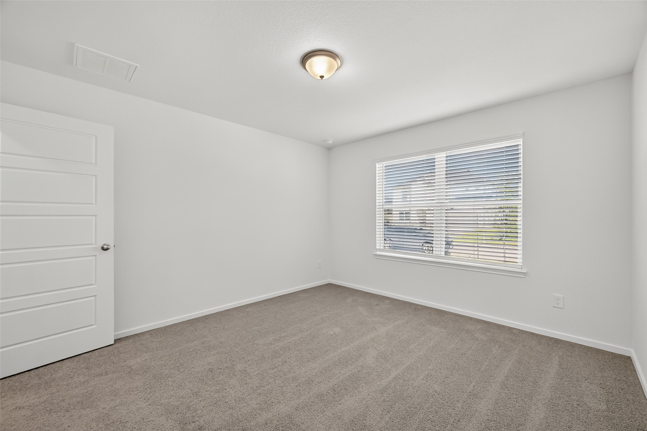 2111 Spring Hollow Drive Baytown, TX 77521 - Photo 17 of 42 a view of an empty room with a window