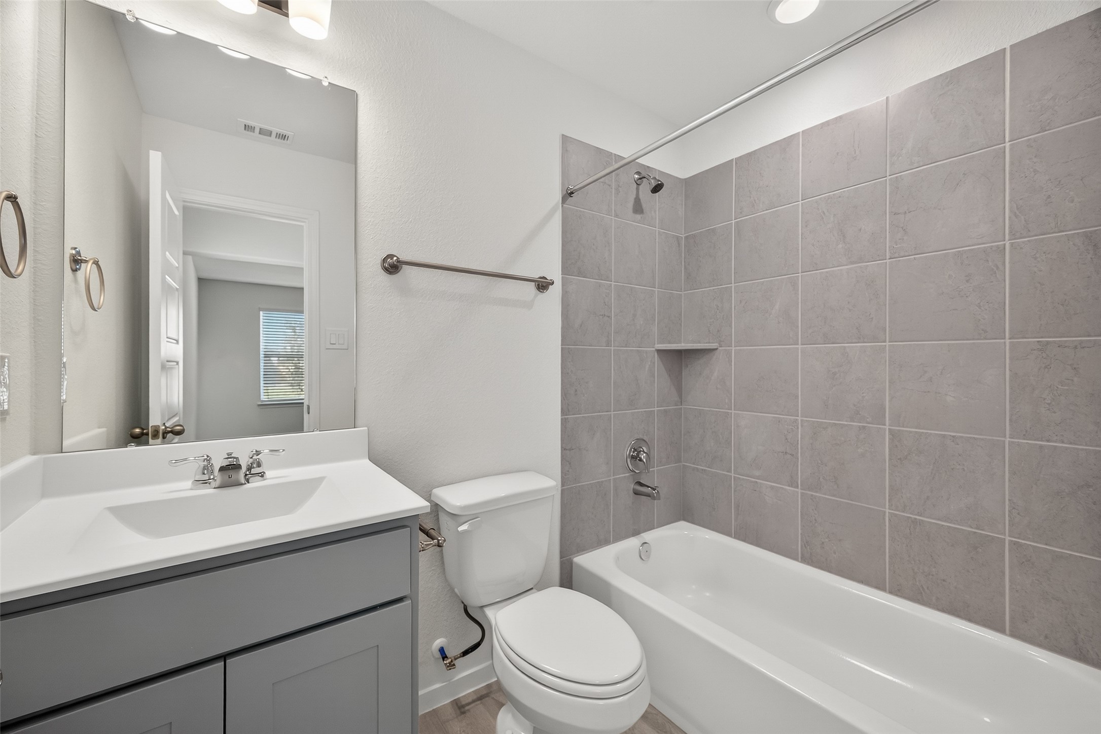 2111 Spring Hollow Drive Baytown, TX 77521 - Photo 19 of 42 a bathroom with a sink toilet and shower