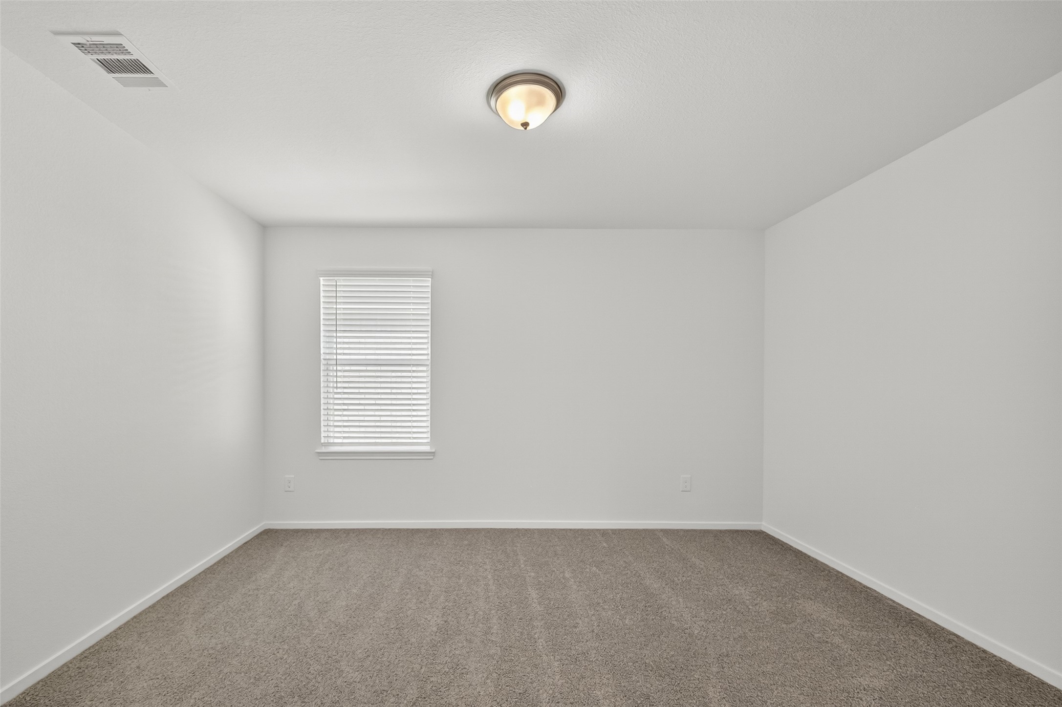 2111 Spring Hollow Drive Baytown, TX 77521 - Photo 21 of 42 a view of an empty room with a window