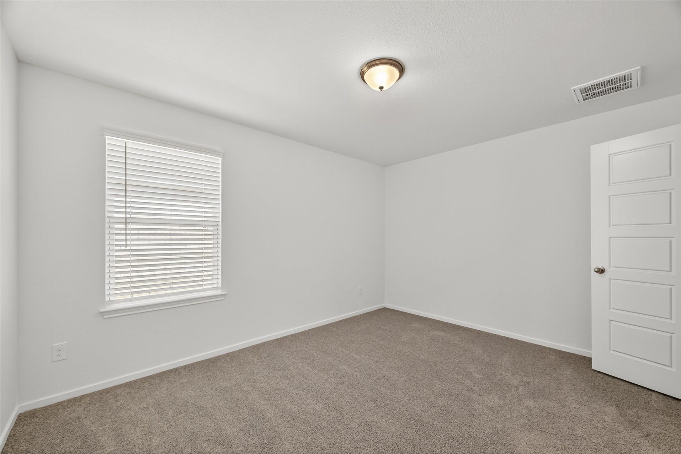 2111 Spring Hollow Drive Baytown, TX 77521 - Photo 22 of 42 an empty room with a window
