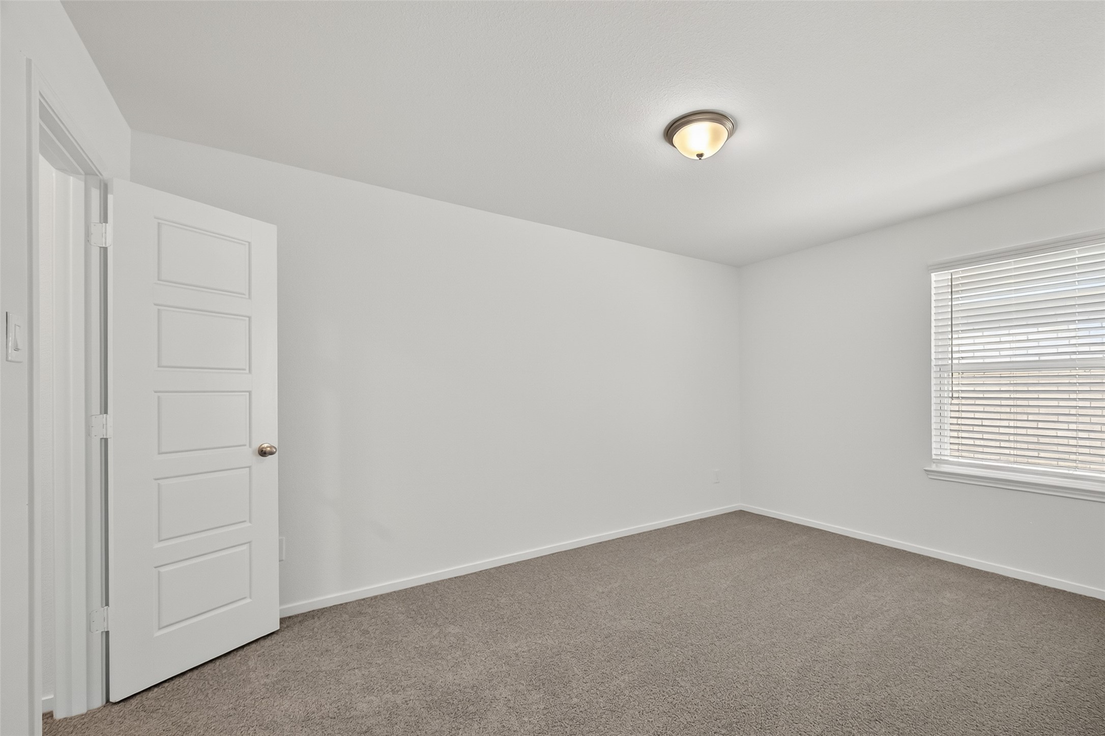 2111 Spring Hollow Drive Baytown, TX 77521 - Photo 26 of 42 an empty room with windows